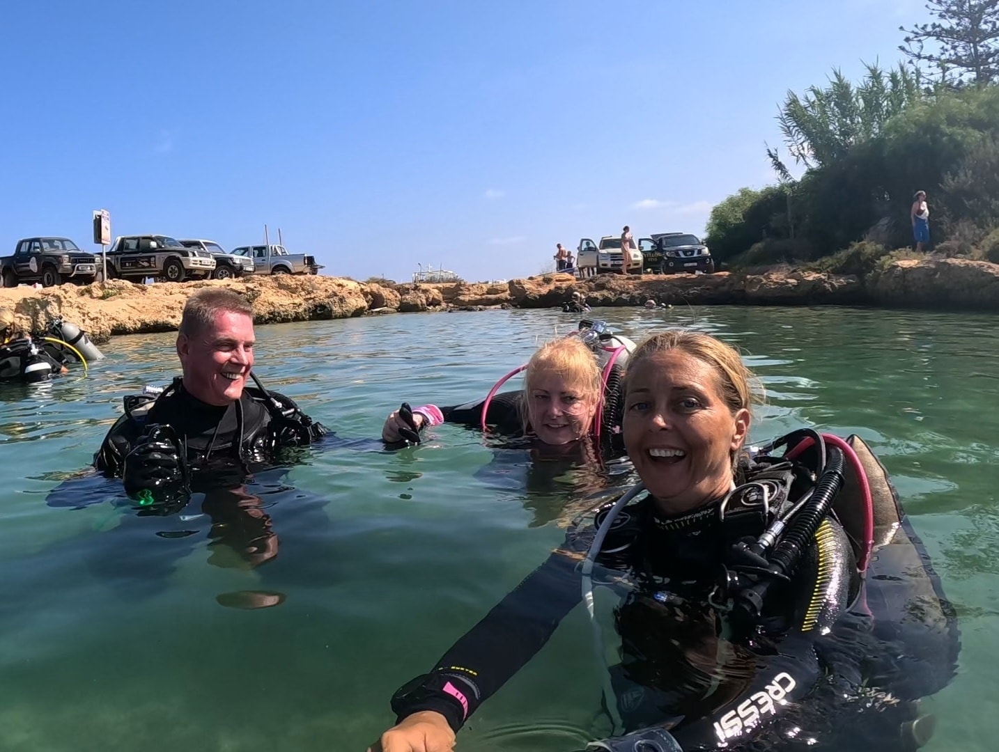 A couple diving with instructor Shelley